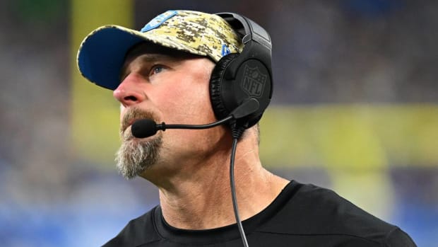 Dan Campbell coaches from the sideline against the Bears.
